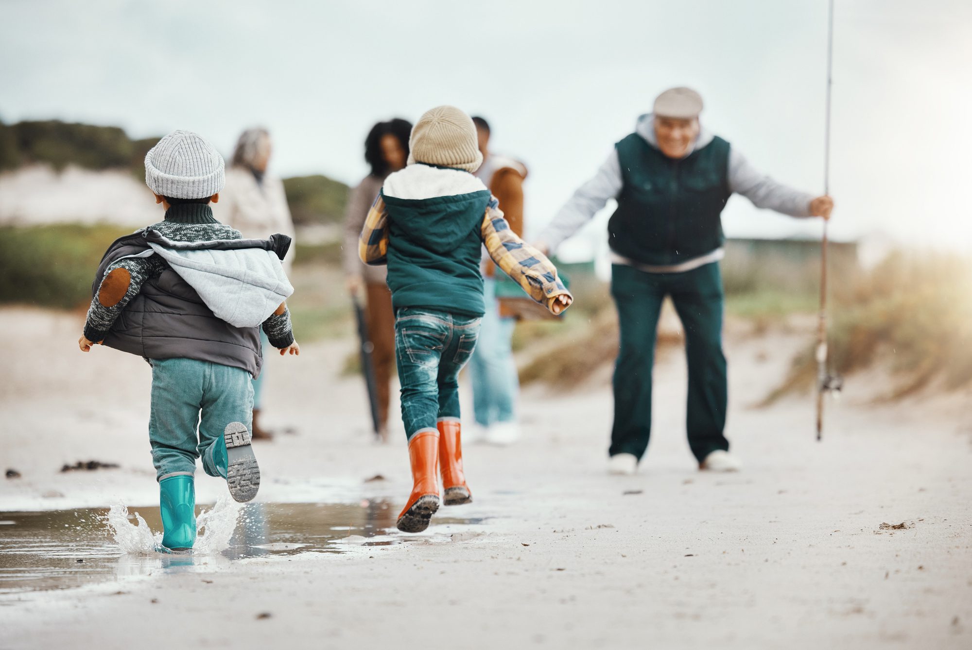 family fishing at the beach